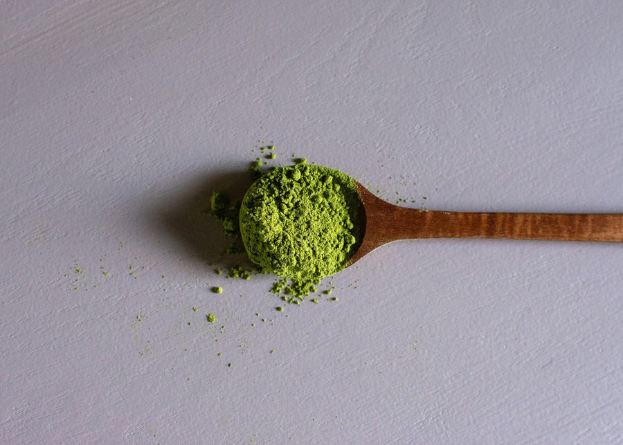 a wooden spoon filled with green kratom powder|Kratom Alkaloids|a researcher holding green leafed plant|Alkaloid Ingredients Infographics