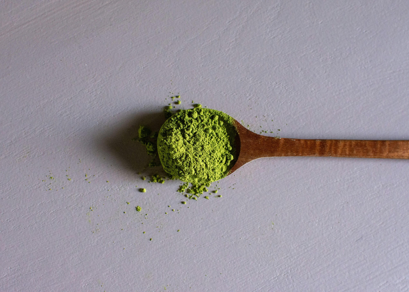 a wooden spoon filled with green kratom powder|Kratom Alkaloids|a researcher holding green leafed plant|Alkaloid Ingredients Infographics