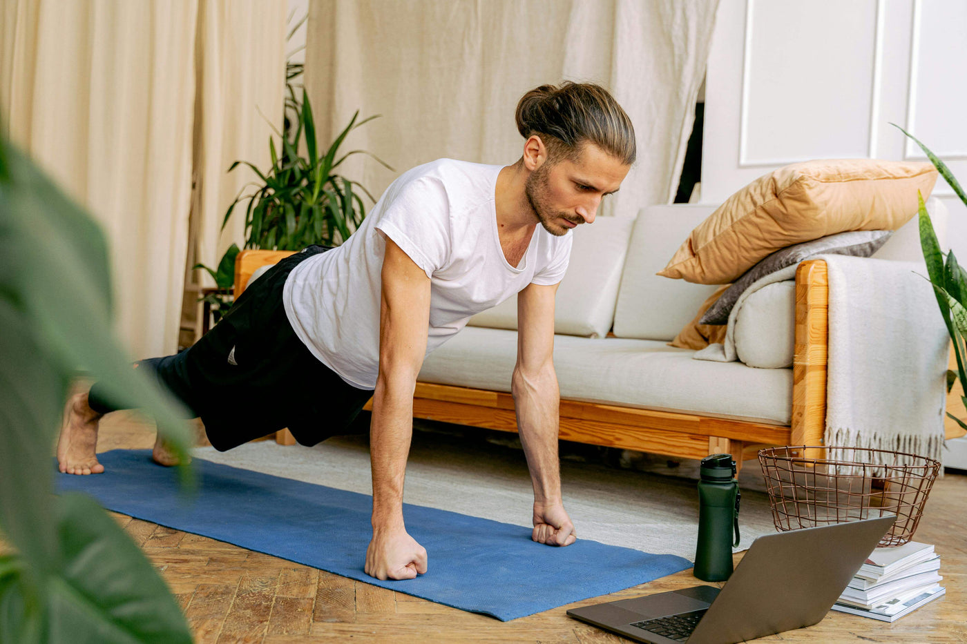a man exercising at home|green drink|