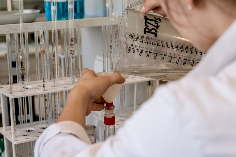 Woman in a lab with diagnostic equipment|Kratom Drug Test|